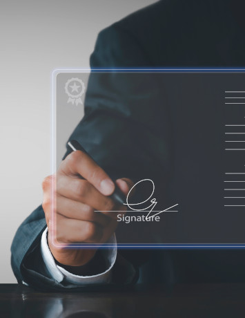Montage: „A symbolically represented digital document in the foreground of the picture is signed by a businessman with a pen“