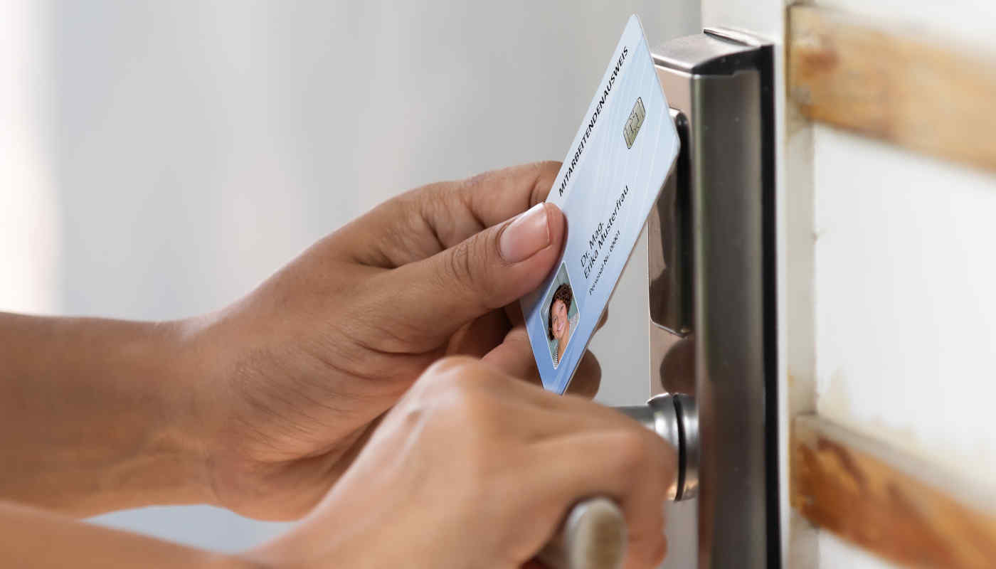 A door is opened with an electronic employee ID card.